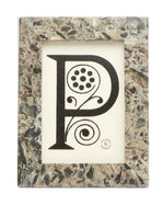 A Pigeon and Poodle Mixed Gray Marble Corsica Frame, 4 x 6 featuring a stylized letter "P" with decorative floral elements inside.