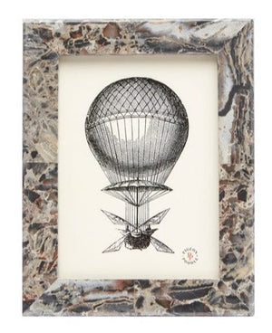 Framed artwork featuring an illustration of a vintage hot air balloon with a Pigeon and Poodle Mixed Gray Marble Corsica Frame, 5 x 7.