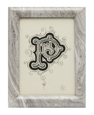 A framed artwork features a decorative, intricate letter "P" with swirling patterns, hand-painted in rich detail. The frame has a Pigeon and Poodle Gray Swirled Lacquered Resin Ashland Frame, 5 x 7 texture, adding an elegant touch to the overall design.