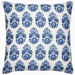 The John Robshaw Adira Indigo Outdoor Pillow features a white background with a repeating blue floral pattern that evokes traditional indigo designs, adding an elegant touch to any area.