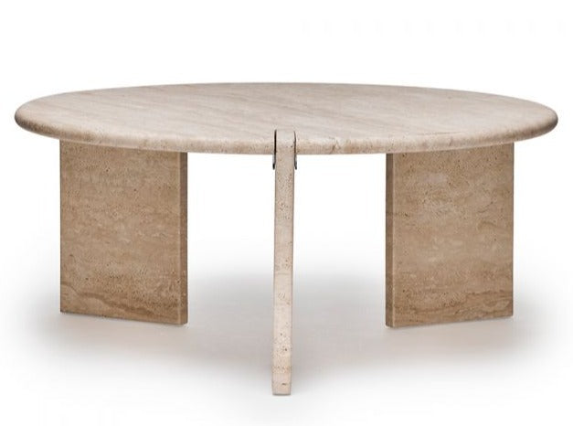 Oval-shaped light brown travertine table with a flat surface and three rectangular support legs; this **Lorenzo Cocktail Table** is a stunning sculptural piece.