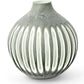 The Aster Vase Collection offers a round, green ceramic vase with a white ombre effect and vertical stripe patterns.