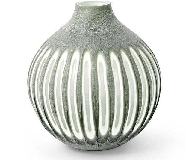 The Aster Vase Collection offers a round, green ceramic vase with a white ombre effect and vertical stripe patterns.