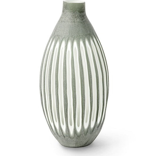 A piece from the Aster Vase Collection, this green ceramic vase boasts an elongated oval shape and vertical white grooves, accentuated by hand-etched sides.