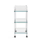 The Ava Acrylic Bar Cart features a clear, three-tier design crafted from glass and acrylic with metal casters, shown from the front against a white background.