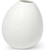 A Vermont Vase Collection piece, white and oval-shaped, features a beautifully textured surface and a narrow opening, making it one of those unique pieces that stand out.
