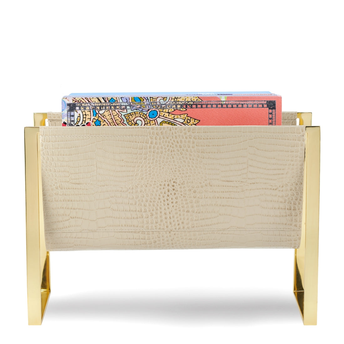 AERIN Classic Croc Magazine Rack in Fawn with a polished brass finish and an Italian Croc Embossed Leather front panel, containing a stack of colorful envelopes and stationery.