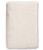 A neatly folded cream-colored Alicia Adams Morgan Throw with a chunky stitch and textured pattern, displayed on a white background.