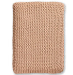 A folded beige Alicia Adams Morgan Throw lies flat against a white background, showcasing its chunky stitch detail.