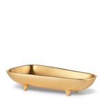 The AERIN Valerio Footed Bowl Collection features a small, gold-colored, bathtub-shaped dish with three short legs and a glossy finish, perfect for serving snacks at your next entertaining event.