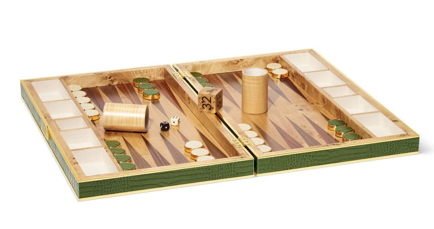 A luxury AERIN Croc Leather Backgammon Set with wooden checkers and dice, opened and placed on a surface. The playing pieces are arranged at the starting position of the game, making it a perfect addition to any board games collection.