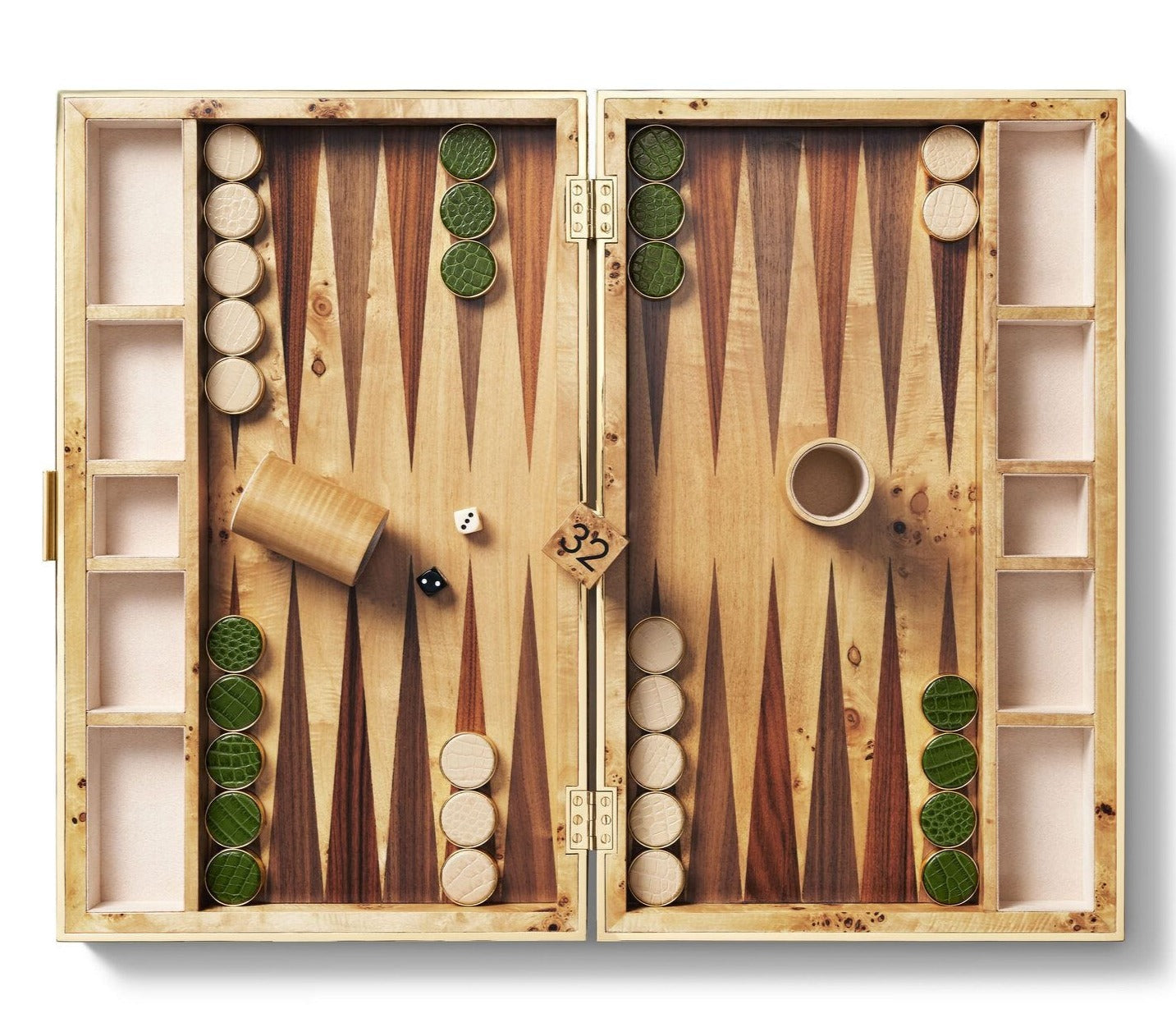 An AERIN Croc Leather Backgammon Set with wooden pieces, two dice, and a dice cup. The luxury set displays a partially played game.