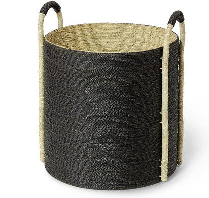 The McKinley Basket Collection includes a round, hand-woven seagrass basket with a black exterior and natural interior, featuring two vertical rope handles for stylish storage.