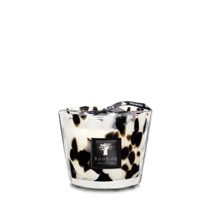 Glass container candle with black and white marbled pattern and a black ribbon attached to the wick, labeled "Baobab Collection Pearls Black Candle." This Baobab Collection Pearls Black Candle adds a touch of elegance to any room.