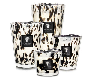 Four Baobab Collection Pearls Black Candles with black and white marbled patterns and black labels are displayed in varying sizes against a white background, including the luxurious Black Pearls variety.