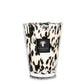 A large Baobab Collection Pearls Black Candle in a glass holder with a black and white spotted design, inspired by Black Pearls.