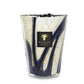 A Baobab Collection Stones Lazuli Candle featuring a marbled design with blue lines, a gold logo label on the front, and infused with hints of cardamom for a touch of aromatic elegance.