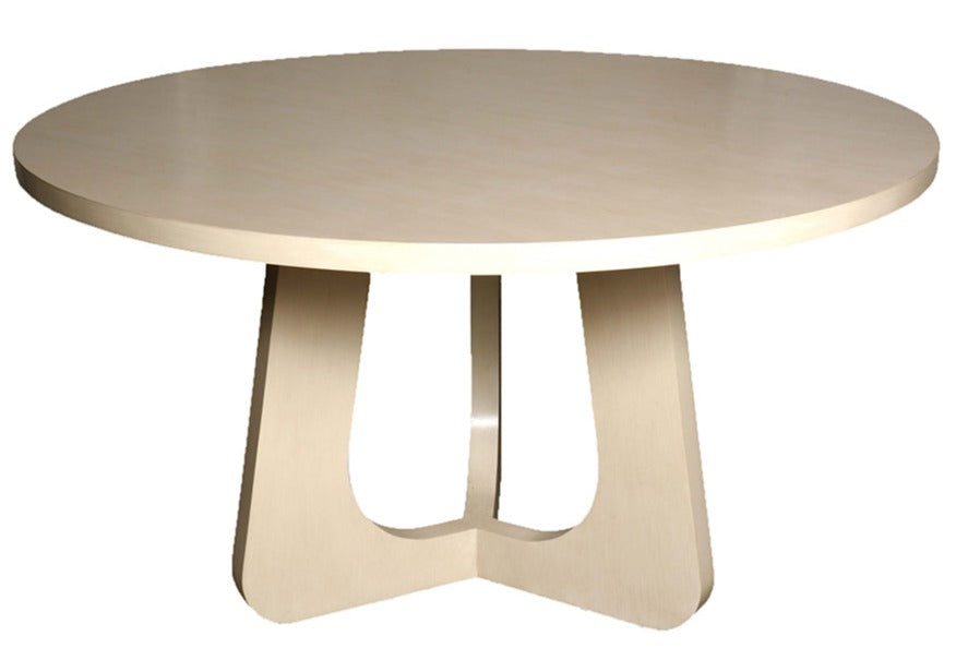 A round wooden table with a light finish and a unique curved, interlocking base exudes character and style, reminiscent of a classic Madeleine Dining Table, Brushed White.