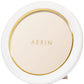 A compact powder with an elegant display, featuring a white and gold design labeled "AERIN Classic Piero Leather Frame Collection" on the lid.