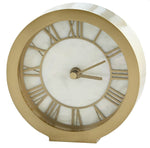 A classic and functional Brass and Mother of Pearl Clock displays brass Roman numerals and has two hands indicating the time.