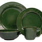 A green ceramic dinnerware set featuring two plates, a bowl, and a mug from the Juliska Puro Basil Collection for a complete table setting.