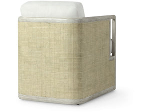 The Aveline Lounge Chair features light-colored woven sides, a white cushion, and a two-tone hardwood frame, shown from an angled side view.