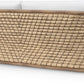 The Capitola Sofa features a woven rattan frame made from synthetic seagrass and white seat cushions, shown from the back on a white background.