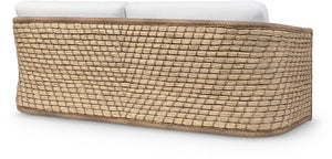 The Capitola Sofa features a woven rattan frame made from synthetic seagrass and white seat cushions, shown from the back on a white background.