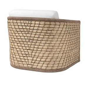 The Capitola Swivel Lounge Chair features a durable powder-coated aluminum frame, woven rattan, a curved back, and a white seat cushion, shown from an angled rear view.