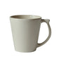 A Jars Vuelta White Pearl Collection mug with a handle, exuding timeless elegance, displayed against a white background.