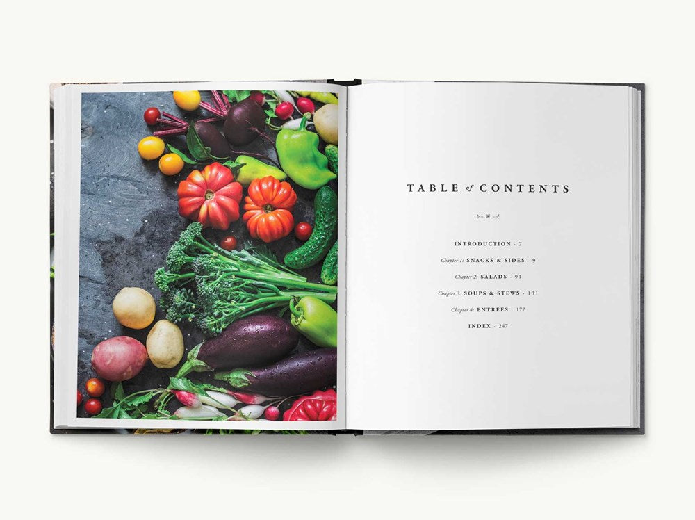 An open Vegetables showcasing vibrant vegetable-forward dishes, with a photograph of colorful vegetables on the left page and a table of contents on the right page.