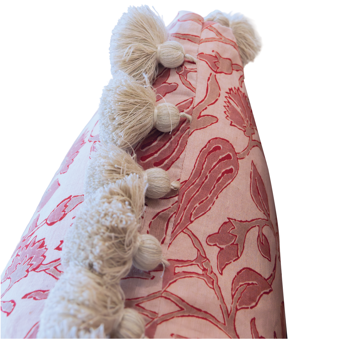 Close-up of the Peacock Garden Pillow, showcasing its pink and white pattern with cream-colored tassels along the edge, set against a white background. This custom pillow features a hidden zipper closure for a seamless look.