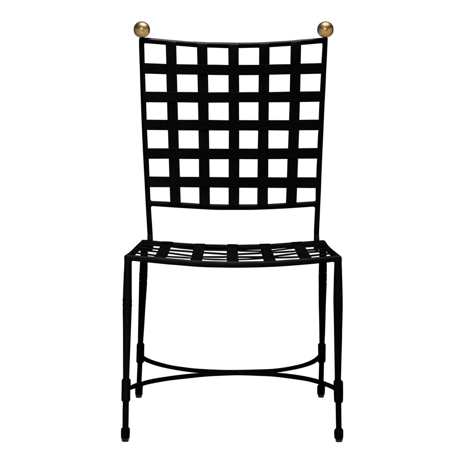 The Janus et Cie Amalfi Dining Side Chair in Slate features a black grid-patterned backrest and seat, stainless steel frames, and two gold spheres—perfect for stylish outdoor settings.