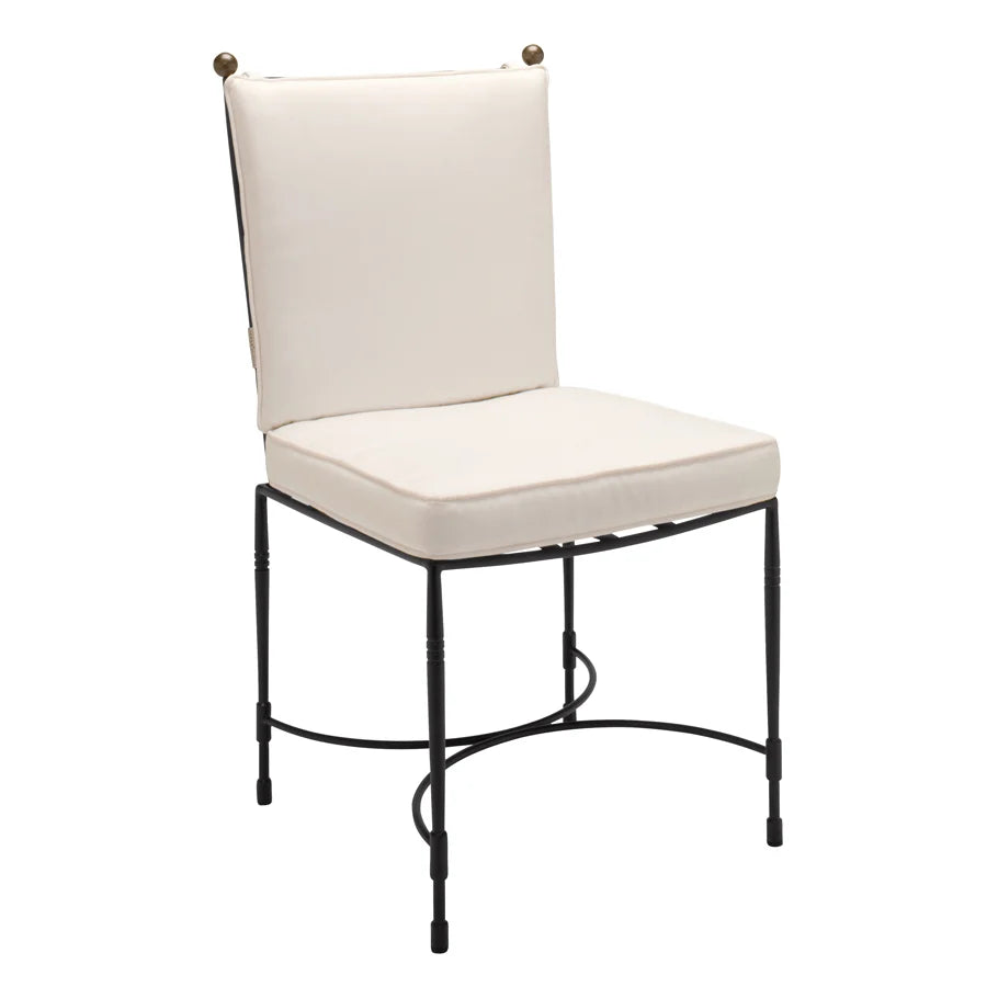 The Janus et Cie Amalfi Dining Side Chair in Slate features a metal frame with a white cushioned seat and backrest, showcasing simple lines and handcrafted details inspired by the Amalfi collection.