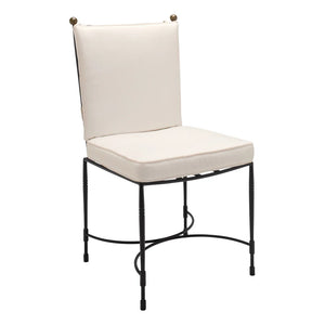 The Janus et Cie Amalfi Dining Side Chair in Slate features a metal frame with a white cushioned seat and backrest, showcasing simple lines and handcrafted details inspired by the Amalfi collection.