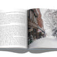 An open book with a picture of a snow-covered street, reminiscent of Assouline's Aspen Style.