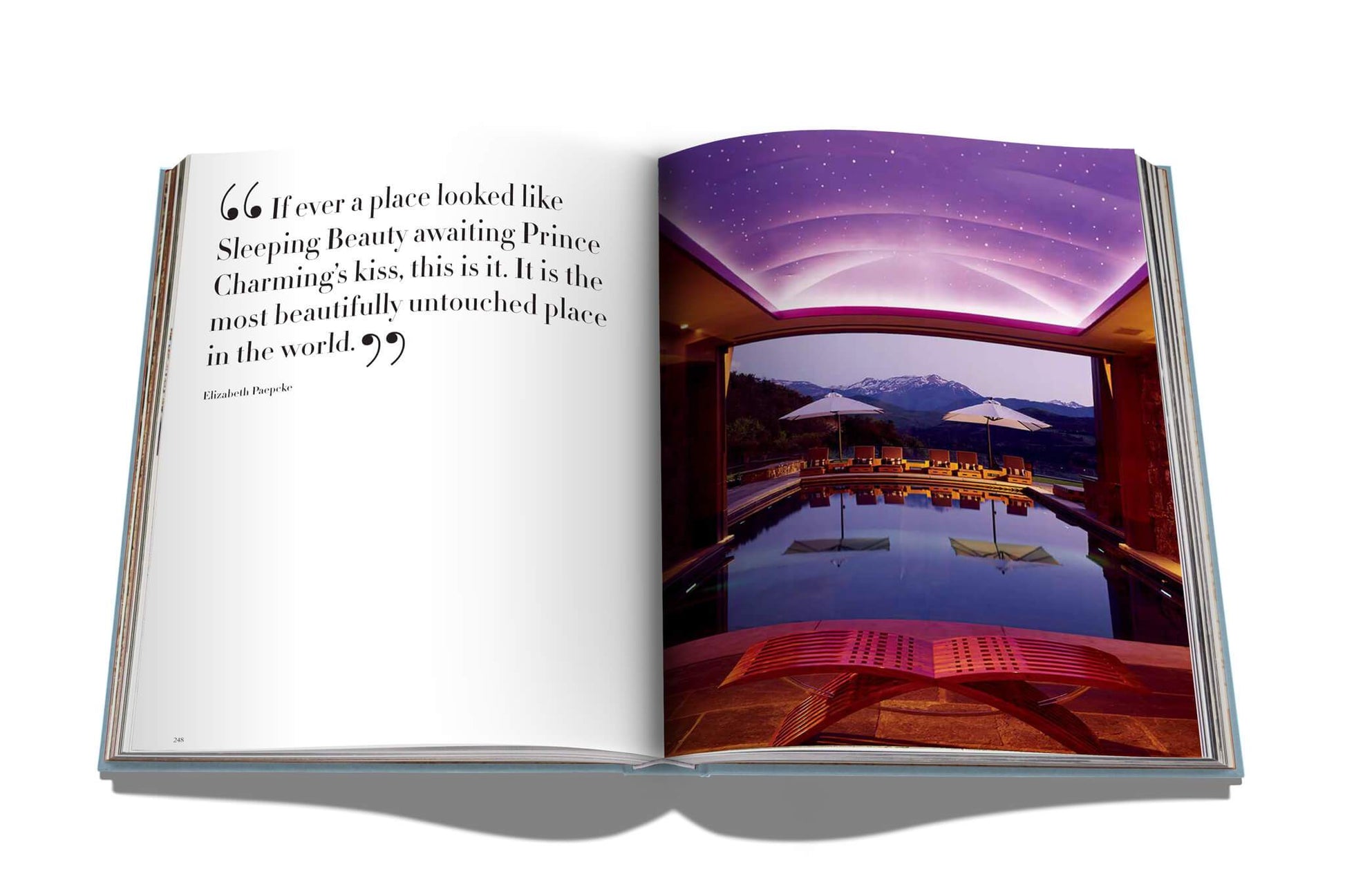 An open book with a picture of a pool and a quote in Assouline Style.