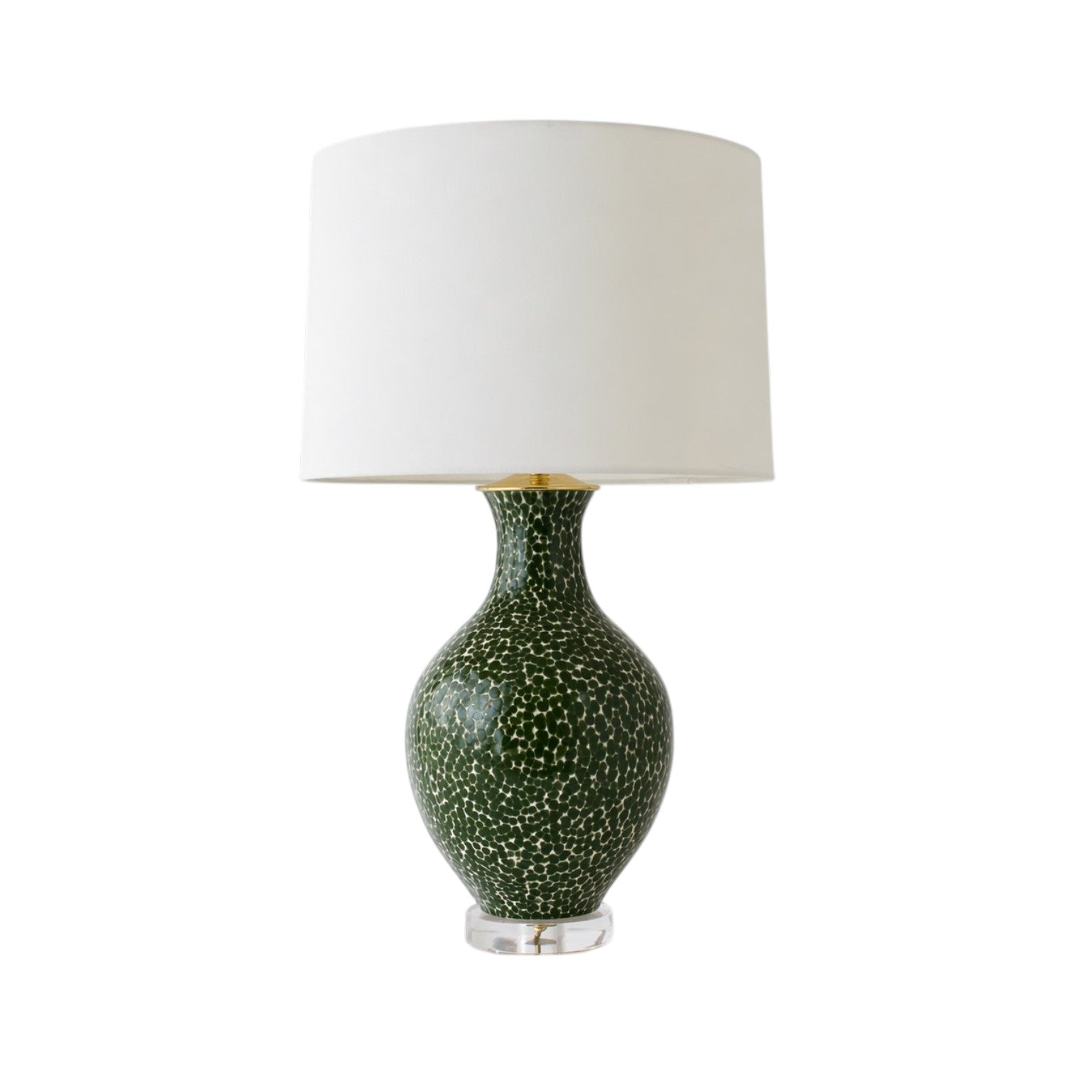 The Athens Large Green Dappled Lamp features a white cylindrical shade and a green dappled ceramic base, exemplifying artistic craftsmanship, set against a white background.