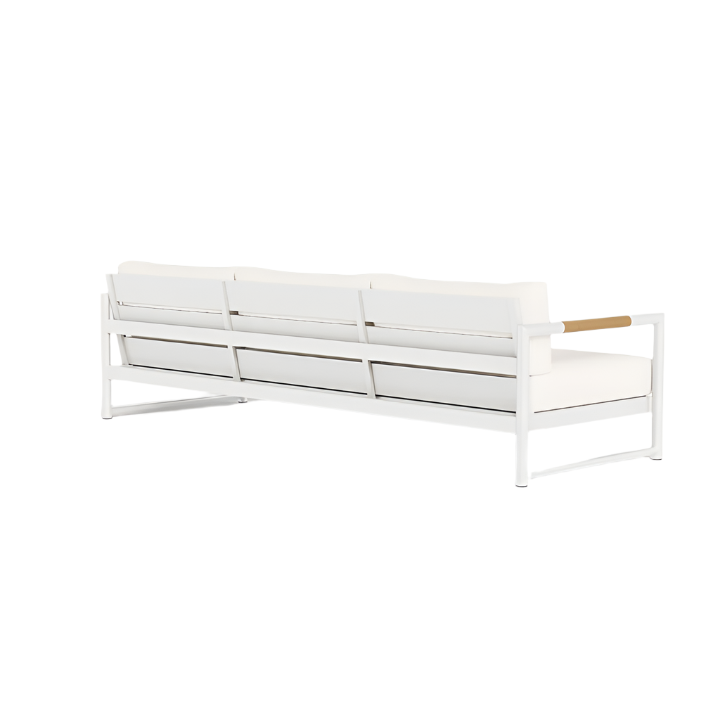The Breeze XL Sofa in White Panama Blanco features a modern metal frame, teak accents, and three seat cushions—ideal for stylish outdoor comfort in your lounge space.