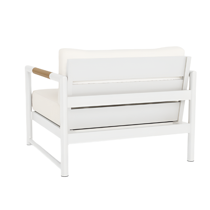 The Breeze XL Lounge Chair in White Panama Blanco features aluminum construction, wooden arm accents, and cream seat and back cushions, shown from the back.