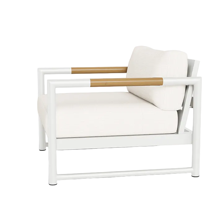 The Breeze XL Lounge Chair showcases a contemporary white look with an aluminum frame, light wood armrests, and cream cushions, displayed at an angle on a white background.