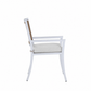 Side view of the Bermuda Arm Chair, featuring a white wood frame, cushioned seat, and woven resin wicker backrest, shown against a plain white background.