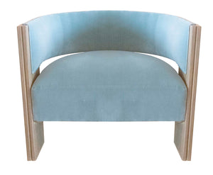 A light blue, round-backed Kanan Lounge Chair reminiscent of an Art Deco lounge chair with a wooden frame and subtle hints of rattan furniture, viewed from the front.