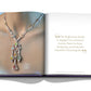 An open book showing a close-up photo of a colorful gemstone necklace on the left page, and a quote about the Boghossian family's gem search as master jewelers on the right page. This is from the product "Boghossian: Expertise, Craftsmanship, Innovation.