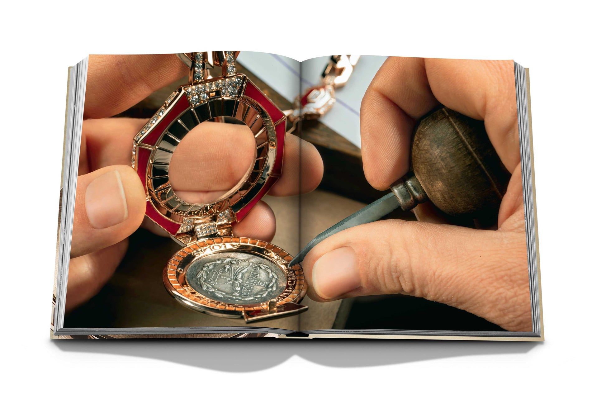 A person uses tools to work on an intricate timepiece. The image appears in an open book, showcasing a detailed view of the jewelry and craftsmanship involved, reminiscent of the Swiss-Italian watchmaking tradition seen in Bulgari Beyond Time.