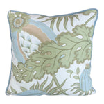 The Carnival Celeste Outdoor Pillow features a blue, green, and beige botanical leaf pattern on white, accented with light blue piping. Expertly crafted from premium materials, it adds a touch of luxury to your custom pillow collection.