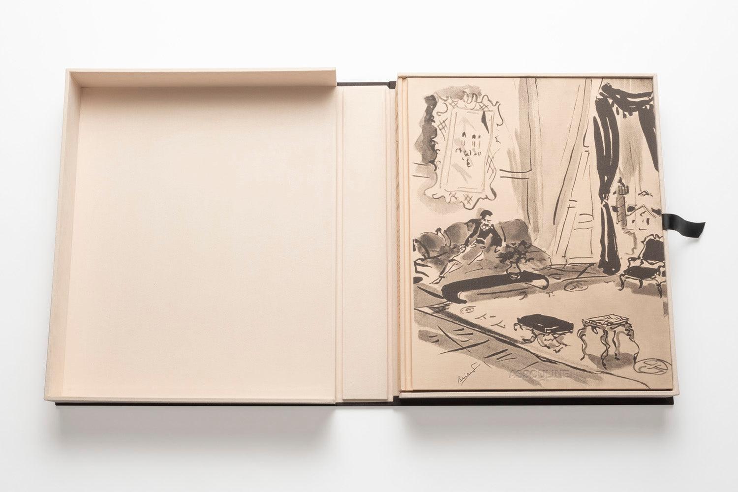 An open book box revealing an illustrated page inside. The left side is empty, with a beige cover reminiscent of Chanel's iconic looks, and the right side shows a black and white drawing with handwritten text from *The Impossible Collection: Chanel*.