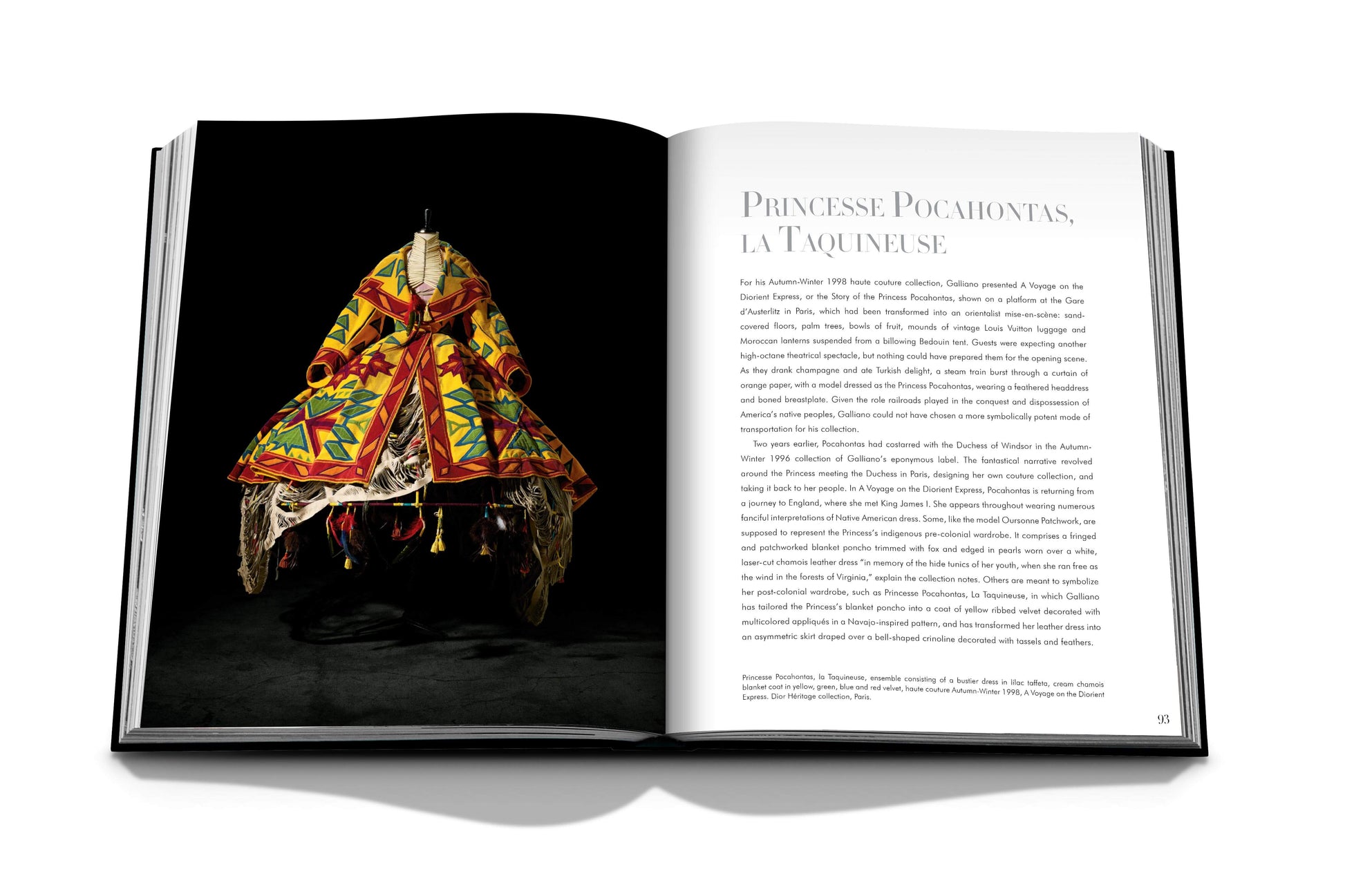 An open book displays a colorful traditional garment on the left page and text in French titled "Princesse Pocahontas, La Tmquelnse" on the right page, reminiscent of **Dior: John Galliano**.