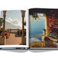 A book with a picture of a balcony overlooking the sea, capturing the beauty of Italy's Assouline lifestyle.