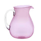 A pink acrylic pitcher with a transparent handle, part of the Memento Acrylic Pink Collection, is elegantly positioned against a white background.